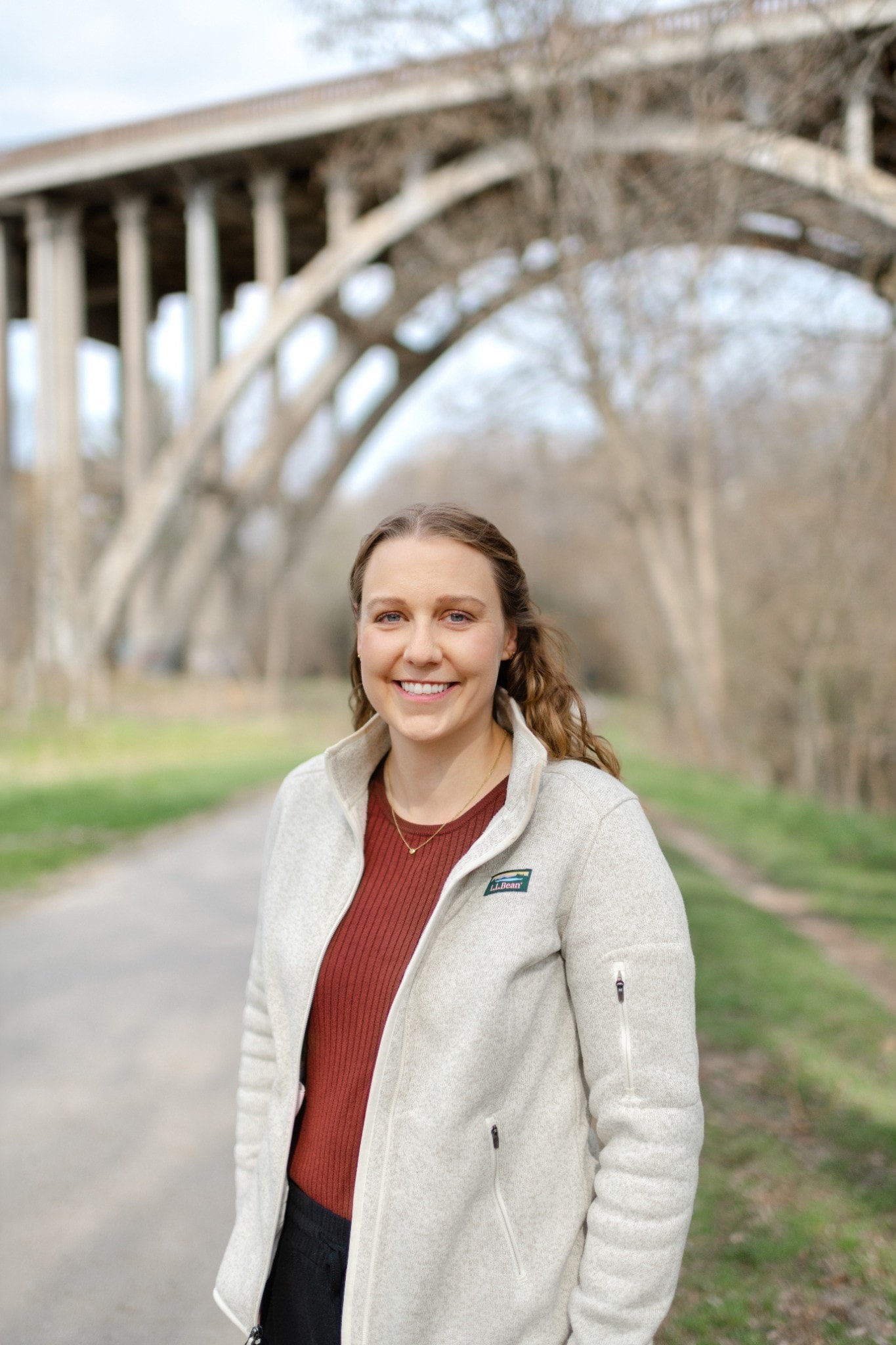 Claire on a path under a bridge in the Beaches